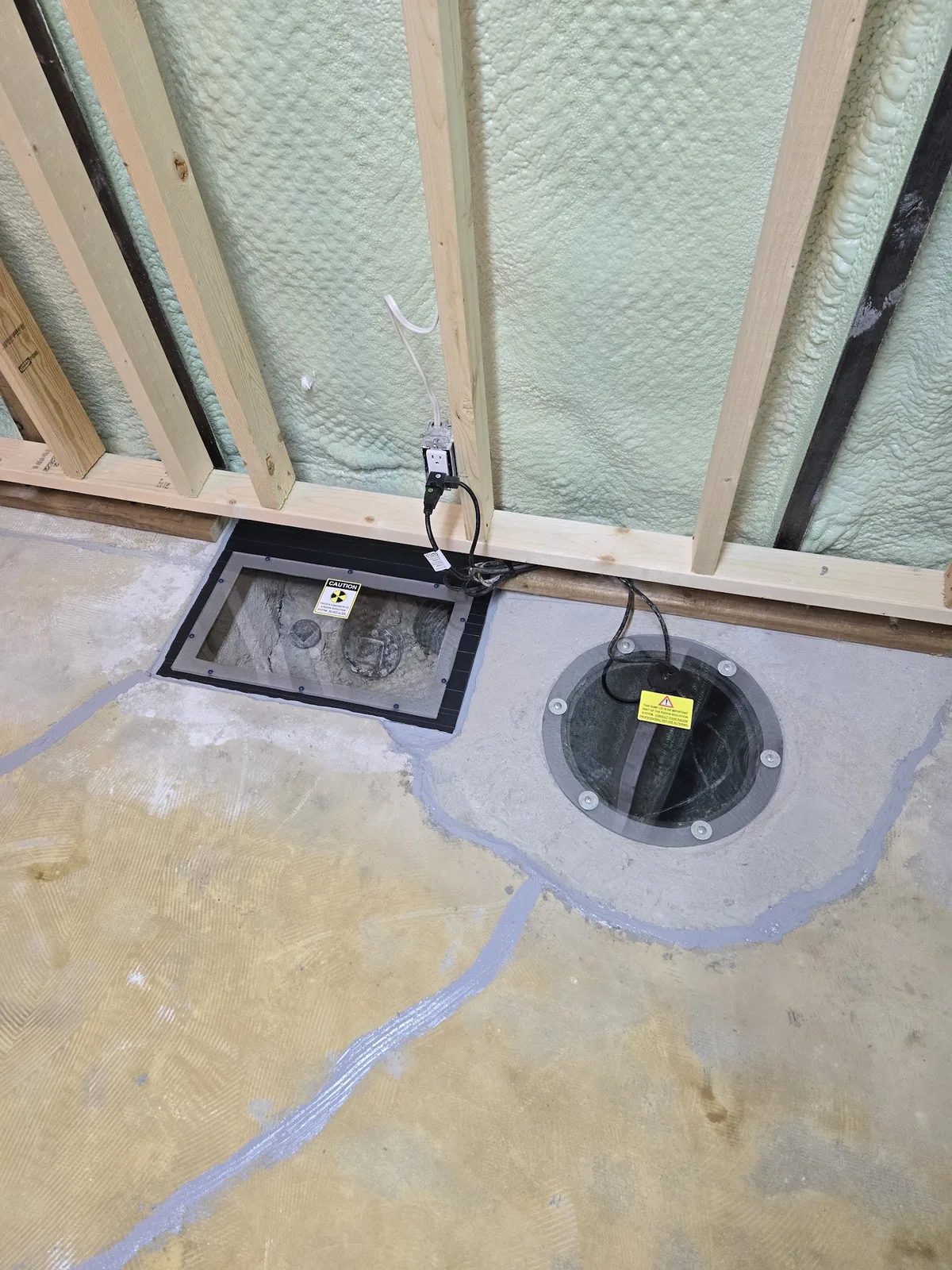 Sealed sub-slab suction points of a Sask Air radon mitigation system