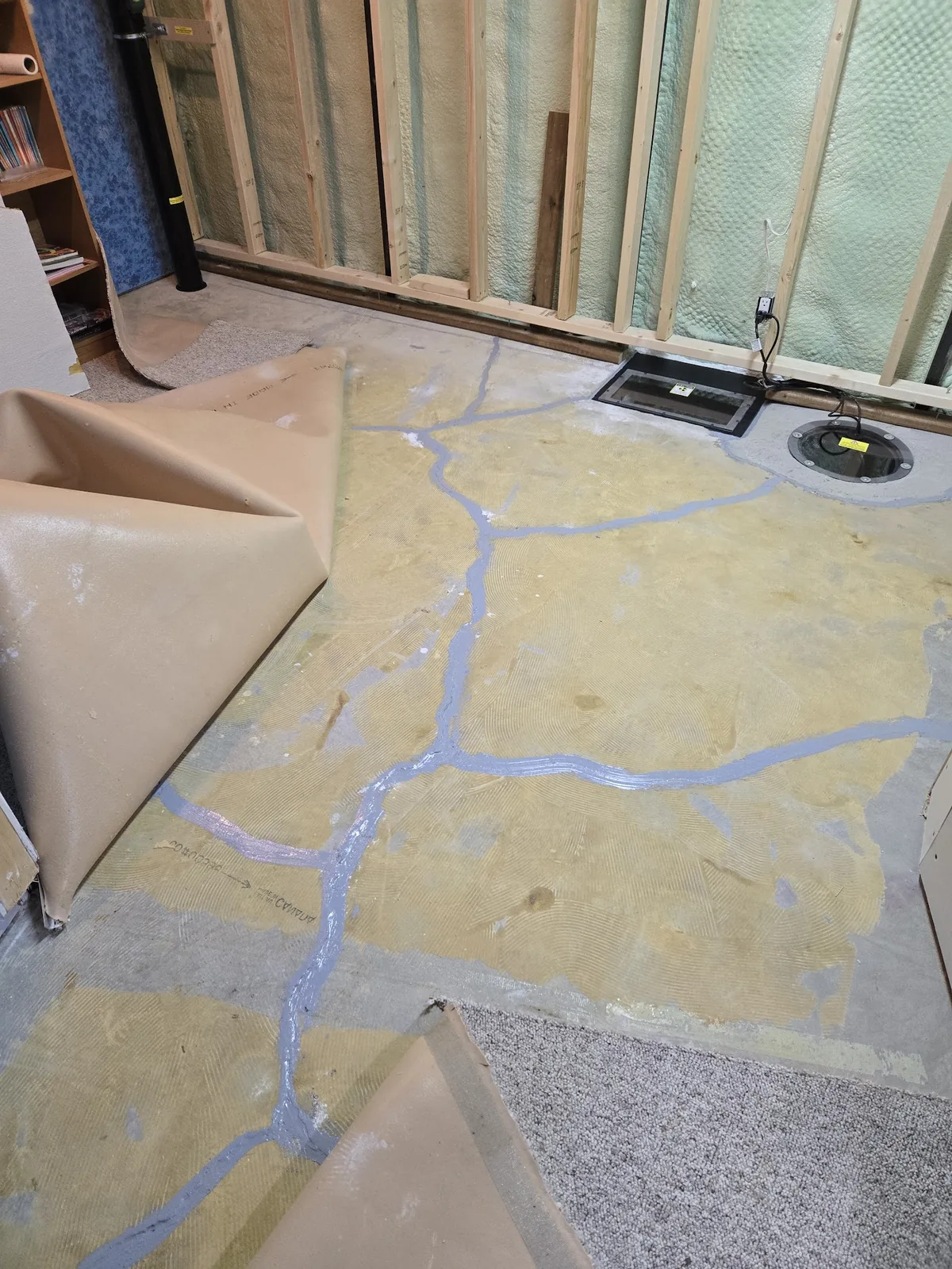 Sask Air Solutions installing a radon mitigation system in a Regina home